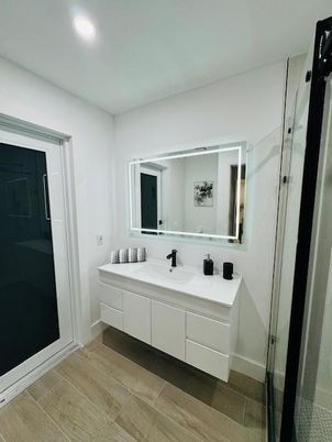 Bathroom, Dual Sink Vanities, Glass Shower, Interior, Recessed Lighting, Wood Texture Flooring