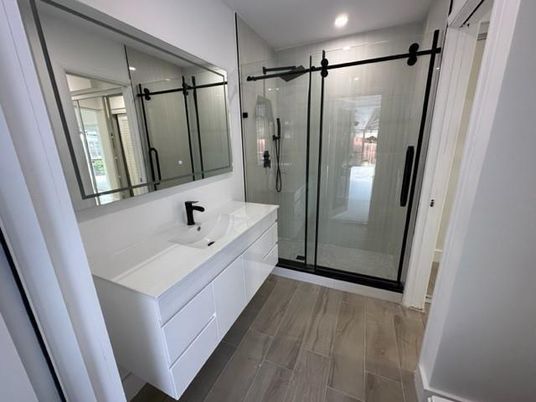 Bathroom, Dual Sink Vanities, Glass Shower, Interior, Recessed Lighting, Wood Texture Flooring