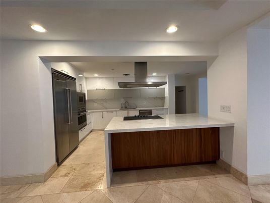 Interior, Kitchen, Marble Walls, Recessed Lighting, Stainless Steel Appliances