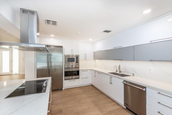 Interior, Kitchen, Marble Walls, Recessed Lighting, Stainless Steel Appliances, Wood Texture Flooring