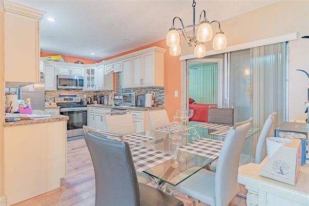 Dining room, Interior, Kitchen, Pendant Lights, Recessed Lighting, Stainless Steel Appliances, Wood Texture Flooring