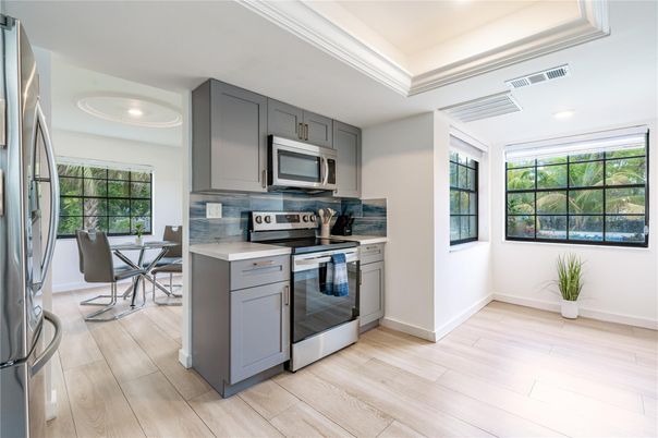 Dining room, Interior, Kitchen, Recessed Lighting, Stainless Steel Appliances, Wood Texture Flooring