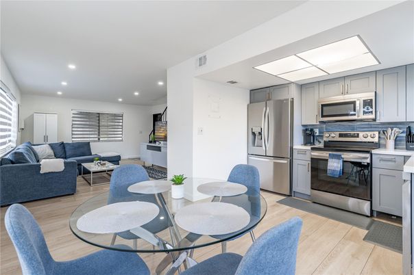 Dining room, Interior, Kitchen, Living room, Recessed Lighting, Stainless Steel Appliances, Wood Texture Flooring