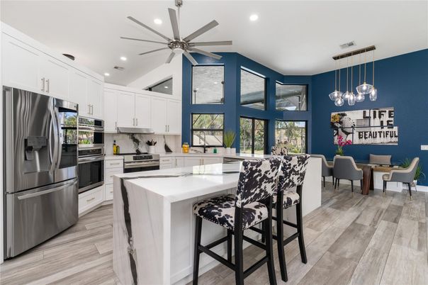 Dining room, Interior, Kitchen, Pendant Lights, Recessed Lighting, Stainless Steel Appliances, Wood Texture Flooring