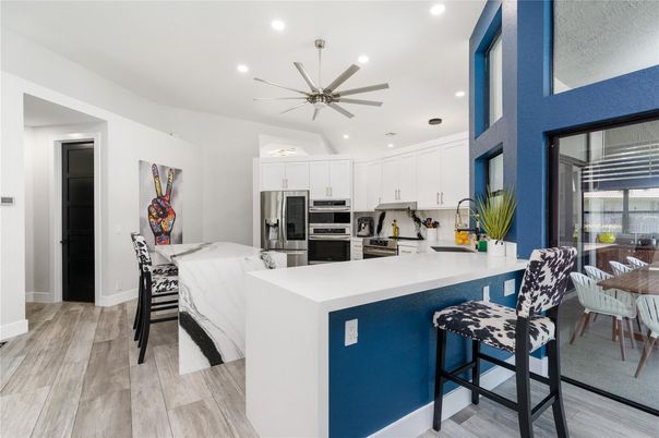 Dining room, Interior, Kitchen, Pendant Lights, Recessed Lighting, Stainless Steel Appliances, Wood Texture Flooring