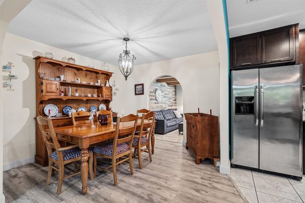 Chandelier, Dining room, Interior, Kitchen, Pendant Lights, Stainless Steel Appliances, Wood Texture Flooring