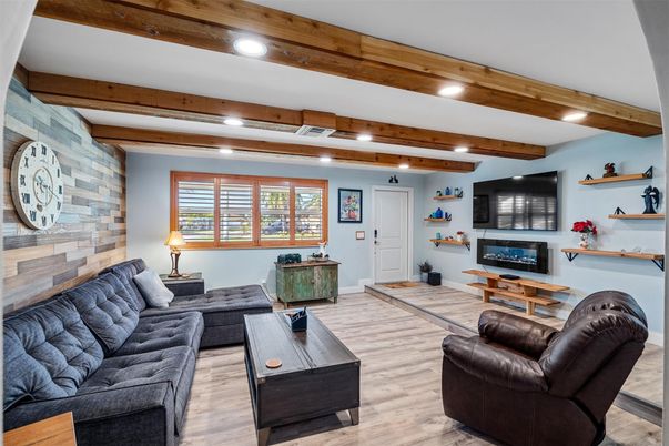 Fireplace, Interior, Living room, Recessed Lighting, Stone Walls, Wooden Beams, Wood Texture Flooring