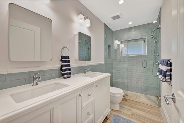 Bathroom, Dual Sink Vanities, Glass Shower, Interior, Recessed Lighting, Wood Texture Flooring