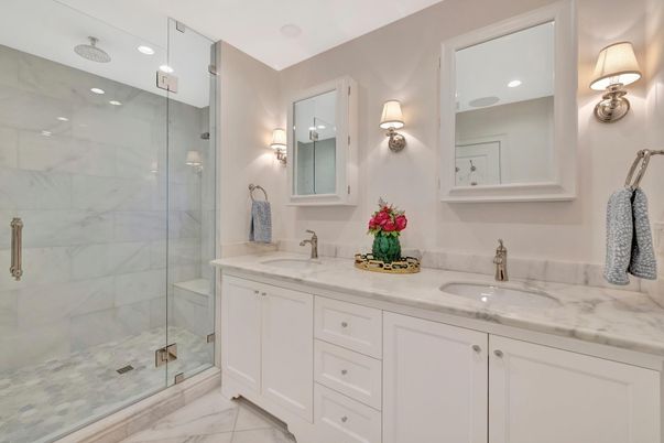 Bathroom, Dual Sink Vanities, Glass Shower, Interior, Marble, Marble Walls, Recessed Lighting