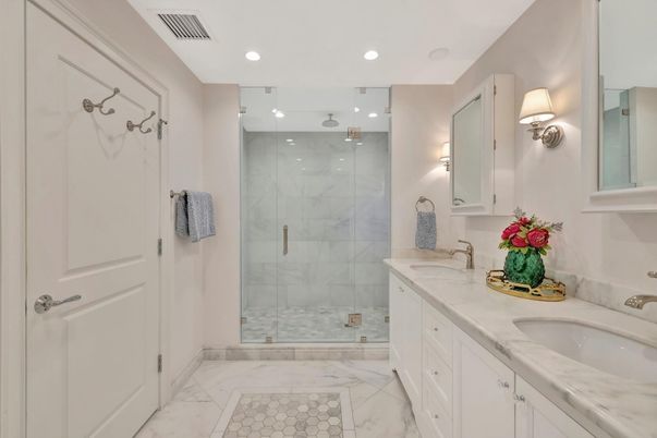 Bathroom, Dual Sink Vanities, Glass Shower, Interior, Marble, Marble Walls, Recessed Lighting