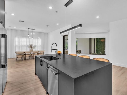 Dining room, Interior, Kitchen, Pendant Lights, Recessed Lighting, Stainless Steel Appliances, Wood Texture Flooring
