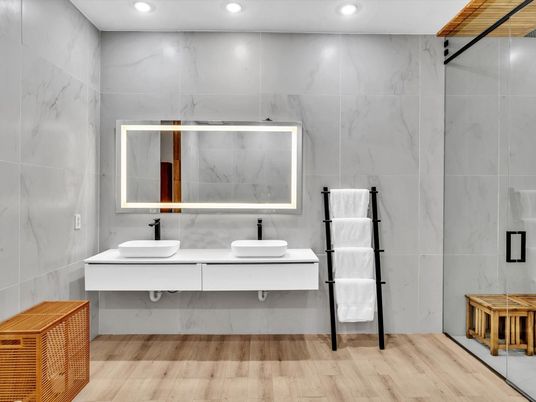 Bathroom, Dual Sink Vanities, Interior, Marble Walls, Recessed Lighting, Wood Texture Flooring