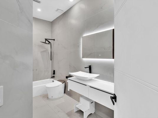 Bathroom, Dual Sink Vanities, Interior, Marble, Marble Walls, Recessed Lighting