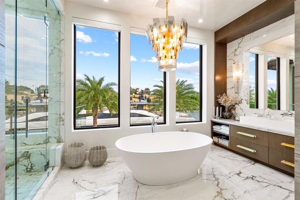 Bathroom, Chandelier, Dual Sink Vanities, Free Standing Baths, Glass Shower, Interior, Marble, Marble Walls, Recessed Lighting