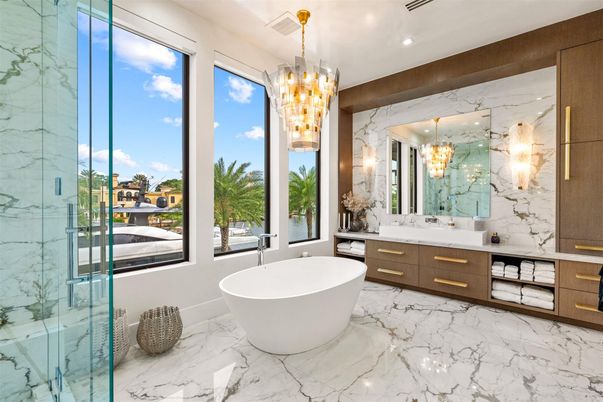 Bathroom, Chandelier, Dual Sink Vanities, Free Standing Baths, Glass Shower, Interior, Marble, Marble Walls, Pendant Lights, Recessed Lighting