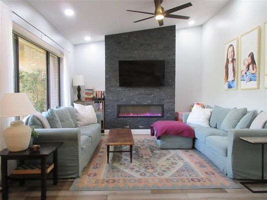 Fireplace, Interior, Living room, Recessed Lighting, Stone Walls, Wood Texture Flooring