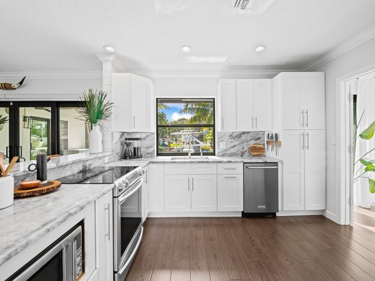 Interior, Kitchen, Marble Walls, Recessed Lighting, Stainless Steel Appliances, Wood Texture Flooring
