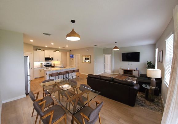 Dining room, Interior, Kitchen, Living room, Pendant Lights, Recessed Lighting, Stainless Steel Appliances, Wood Texture Flooring