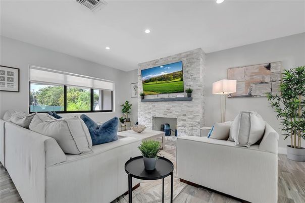 Fireplace, Interior, Living room, Recessed Lighting, Stone Walls, Wood Texture Flooring