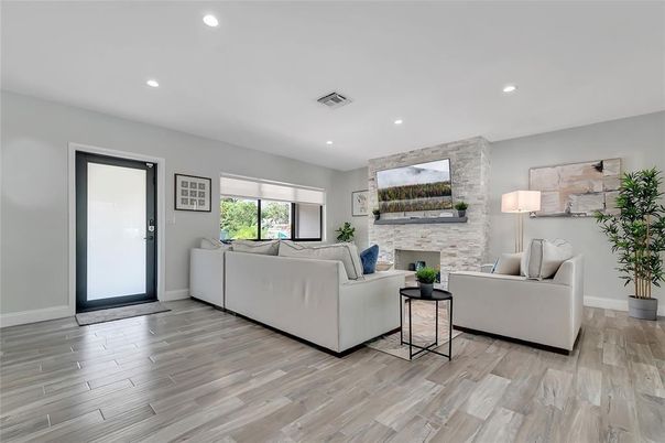 Fireplace, Interior, Living room, Recessed Lighting, Stone Walls, Wood Texture Flooring