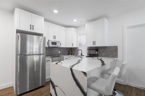 Interior, Kitchen, Recessed Lighting, Stainless Steel Appliances, Wood Texture Flooring