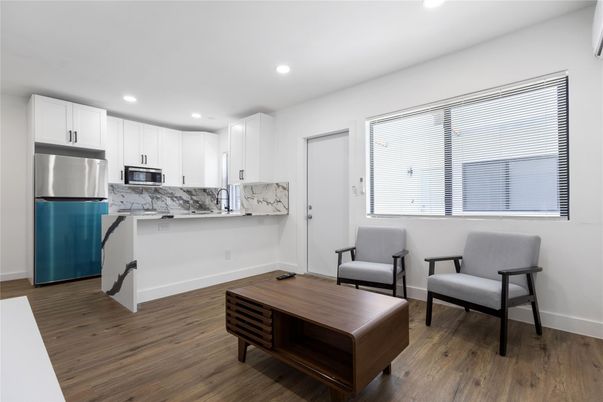 Interior, Kitchen, Marble Walls, Recessed Lighting, Stainless Steel Appliances, Wood Texture Flooring