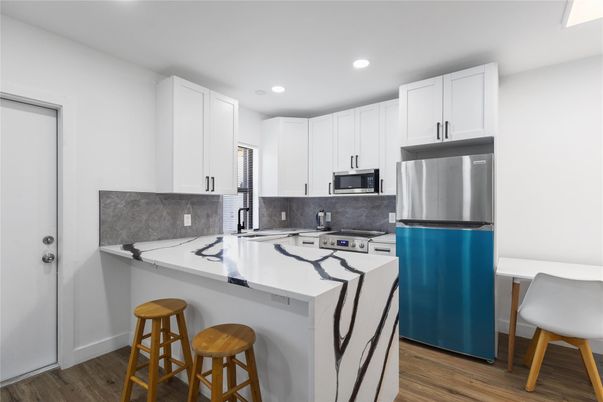 Interior, Kitchen, Recessed Lighting, Stainless Steel Appliances, Wood Texture Flooring