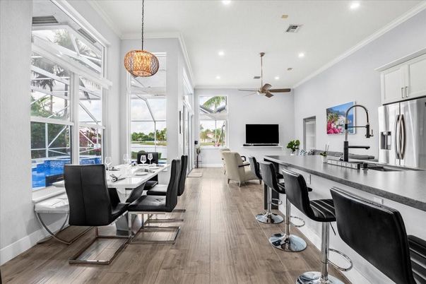 Dining room, Interior, Kitchen, Pendant Lights, Recessed Lighting, Stainless Steel Appliances, Wood Texture Flooring