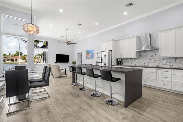 Dining room, Interior, Kitchen, Pendant Lights, Recessed Lighting, Stainless Steel Appliances, Wood Texture Flooring