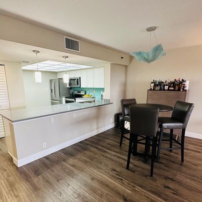 Dining room, Interior, Kitchen, Pendant Lights, Stainless Steel Appliances, Wood Texture Flooring