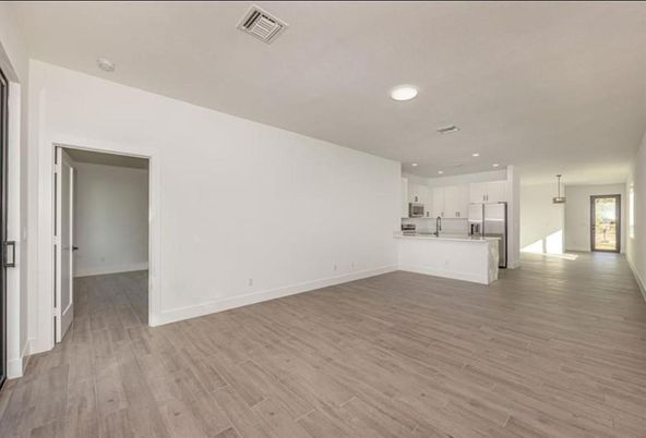 Empty room, Interior, Kitchen, Pendant Lights, Recessed Lighting, Wood Texture Flooring