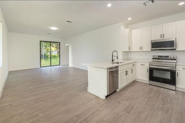 Interior, Kitchen, Recessed Lighting, Stainless Steel Appliances, Wood Texture Flooring