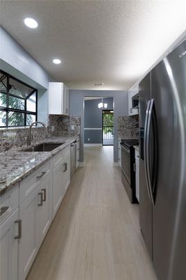 Interior, Kitchen, Recessed Lighting, Stainless Steel Appliances, Wood Texture Flooring
