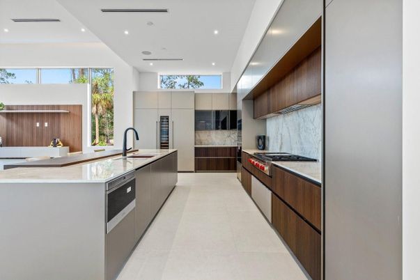 Interior, Kitchen, Marble Walls, Recessed Lighting, Stainless Steel Appliances