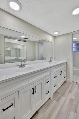Bathroom, Dual Sink Vanities, Interior, Recessed Lighting, Wood Texture Flooring