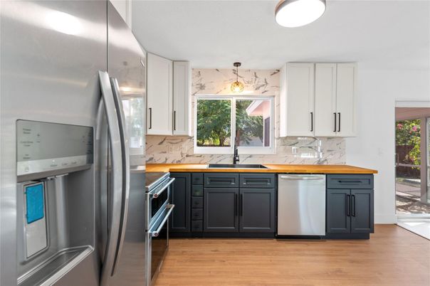 Interior, Kitchen, Marble Walls, Stainless Steel Appliances, Wood Texture Flooring
