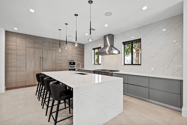 Interior, Kitchen, Marble Walls, Pendant Lights, Recessed Lighting, Stainless Steel Appliances