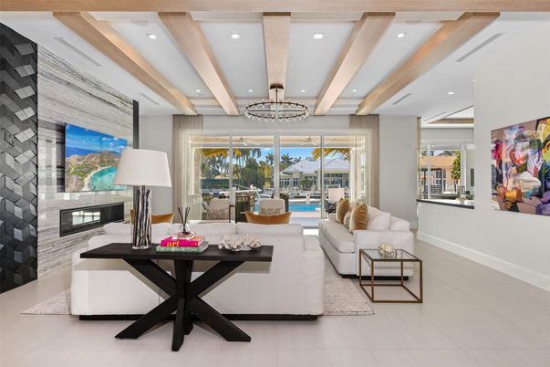 Chandelier, Fireplace, Interior, Living room, Recessed Lighting, Stone Walls, Wooden Beams