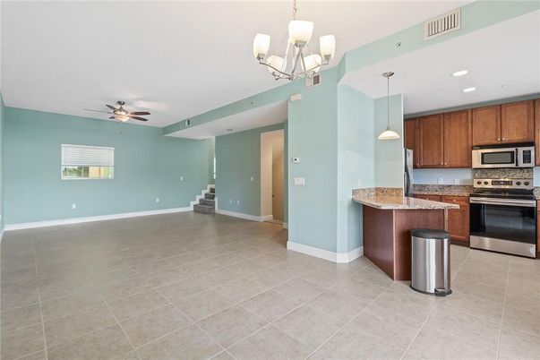 Chandelier, Empty room, Interior, Kitchen, Pendant Lights, Recessed Lighting, Stainless Steel Appliances