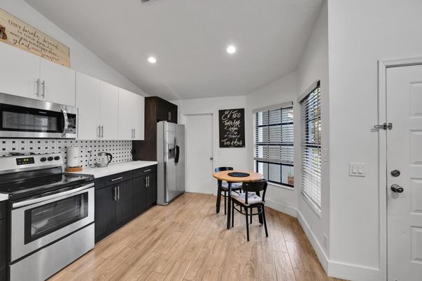 Dining room, Interior, Kitchen, Recessed Lighting, Stainless Steel Appliances, Wood Texture Flooring