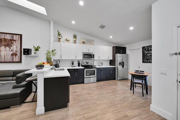Dining room, Interior, Kitchen, Recessed Lighting, Stainless Steel Appliances, Wood Texture Flooring