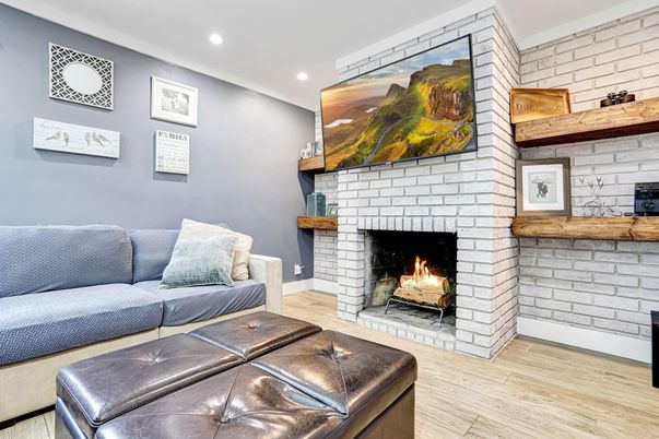 Fireplace, Interior, Living room, Recessed Lighting, Stone Walls, Wood Texture Flooring