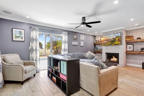 Fireplace, Interior, Living room, Recessed Lighting, Stone Walls, Wood Texture Flooring