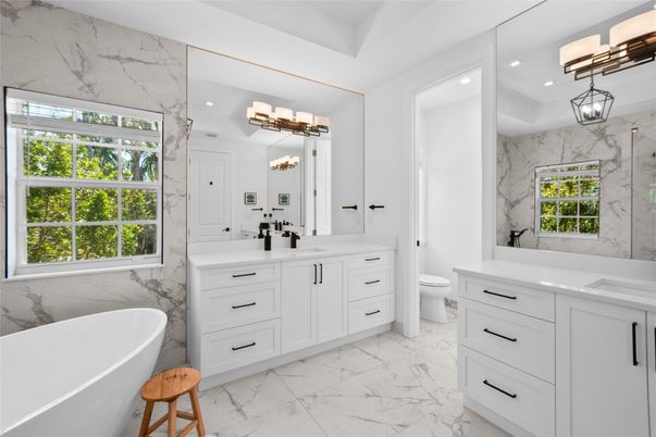 Bathroom, Dual Sink Vanities, Free Standing Baths, Interior, Marble, Marble Walls, Pendant Lights, Recessed Lighting