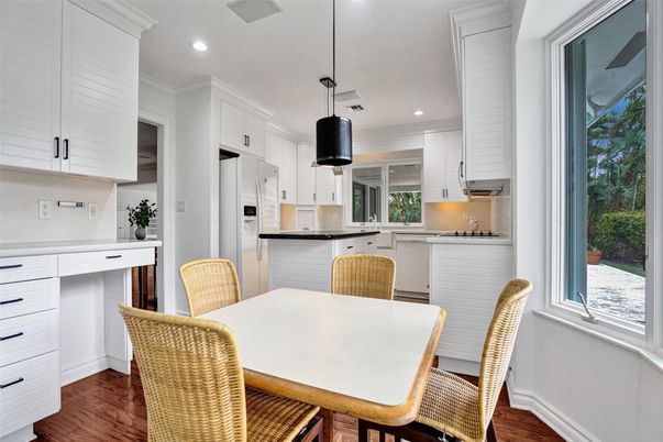 Dining room, Interior, Kitchen, Pendant Lights, Recessed Lighting, Stainless Steel Appliances, Wood Texture Flooring