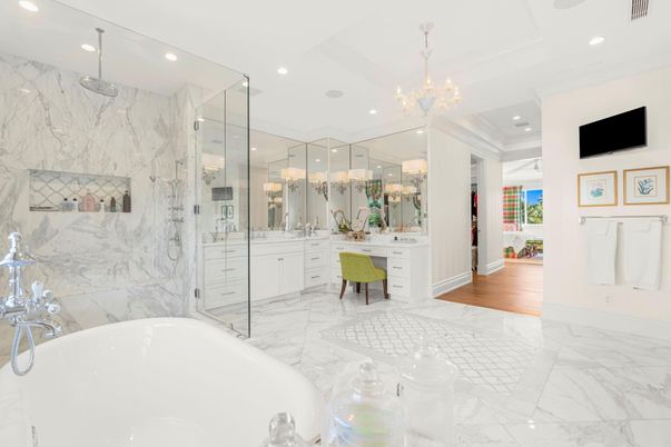 Bathroom, Chandelier, Free Standing Baths, Glass Shower, Interior, Marble, Marble Walls, Recessed Lighting, Wood Texture Flooring