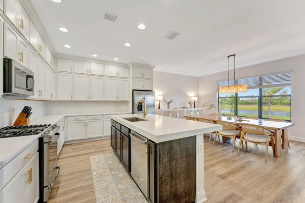 Chandelier, Dining room, Interior, Kitchen, Pendant Lights, Recessed Lighting, Stainless Steel Appliances, Wood Texture Flooring