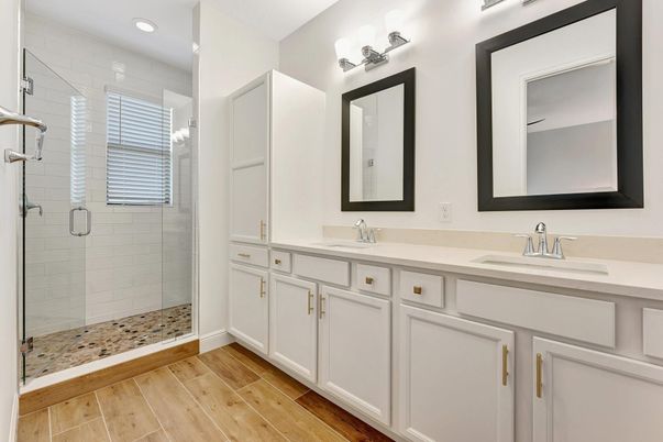 Bathroom, Dual Sink Vanities, Glass Shower, Interior, Recessed Lighting, Wood Texture Flooring