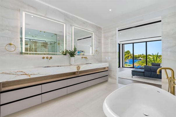 Bathroom, Dual Sink Vanities, Free Standing Baths, Glass Shower, Interior, Marble Walls, Recessed Lighting