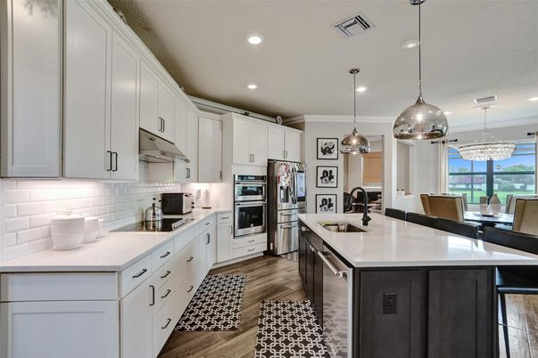 Dining room, Interior, Kitchen, Pendant Lights, Recessed Lighting, Stainless Steel Appliances, Wood Texture Flooring